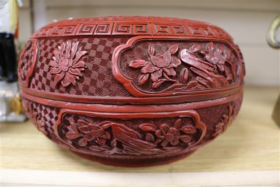 A 19th century Chinese cinnabar lacquer box and cover, diameter 10in.